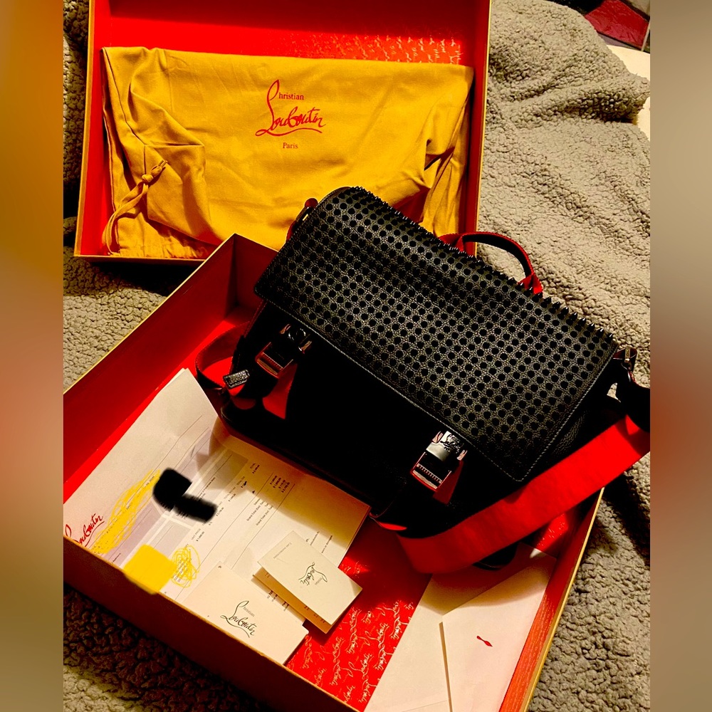 I have a Flawless Christian Louboutin messenger bag never worn.